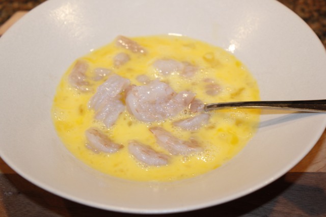 Coat shrimp with egg mixture
